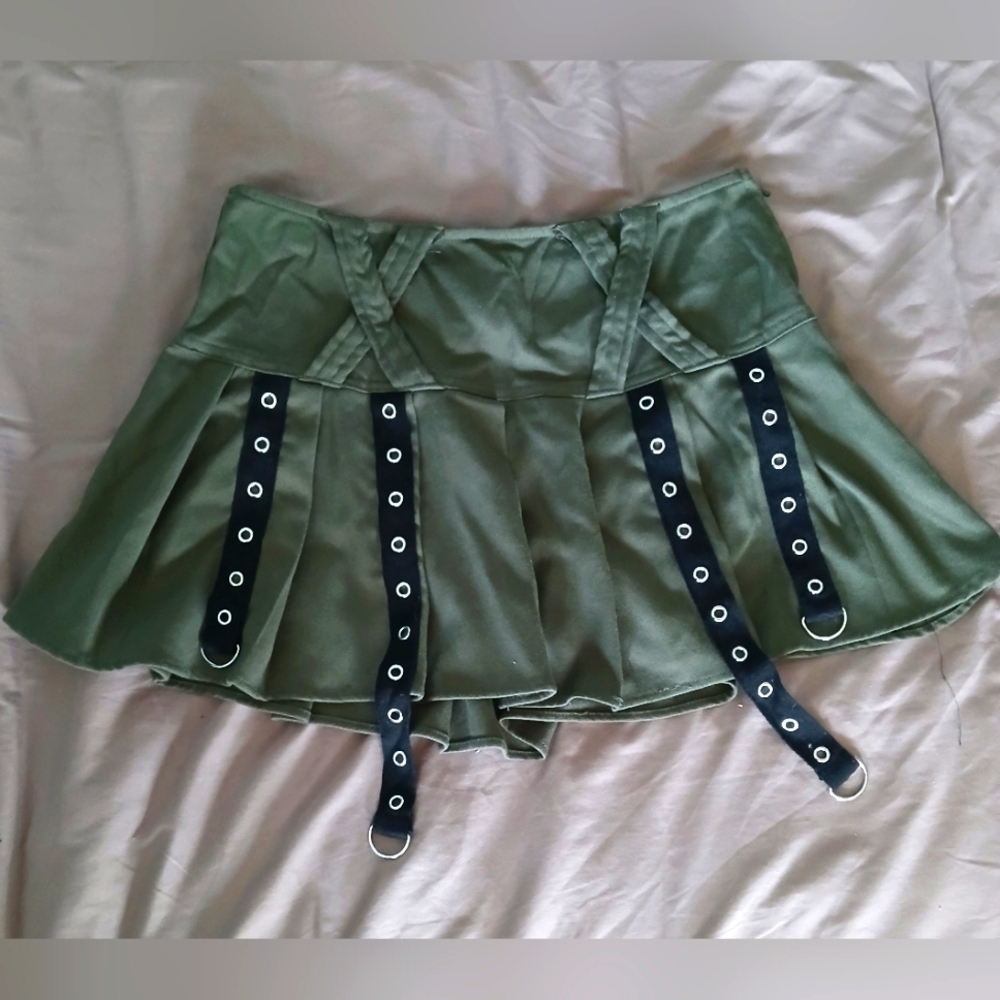 Social Collision green bondage strap pleated mini skirt
